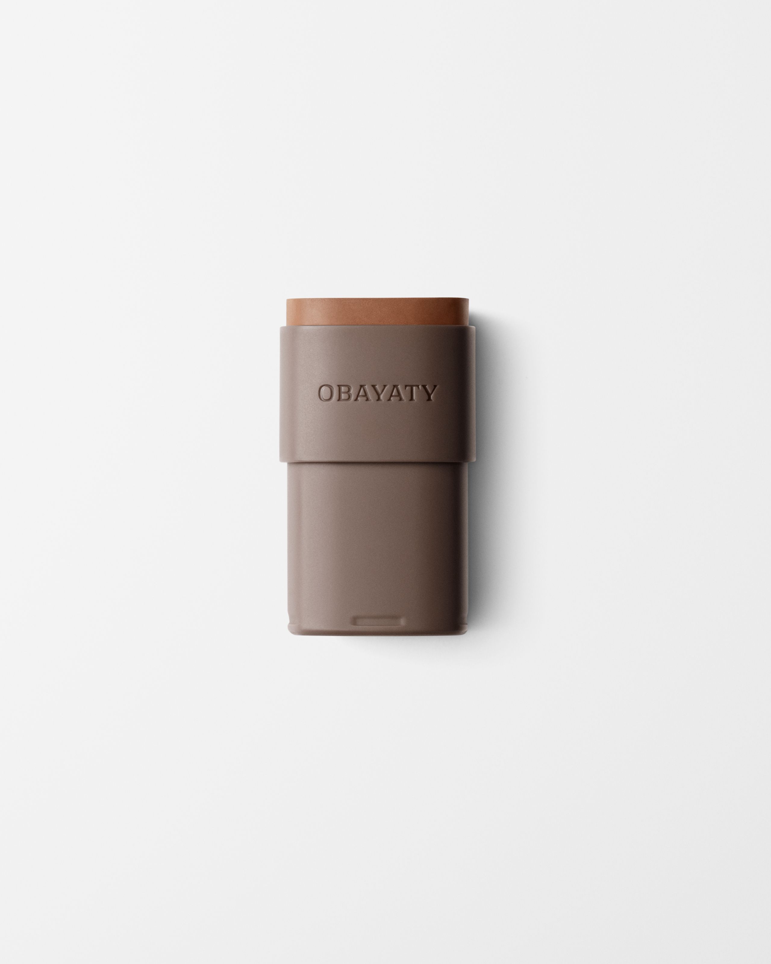 Bronzer refill laying on a grey surface