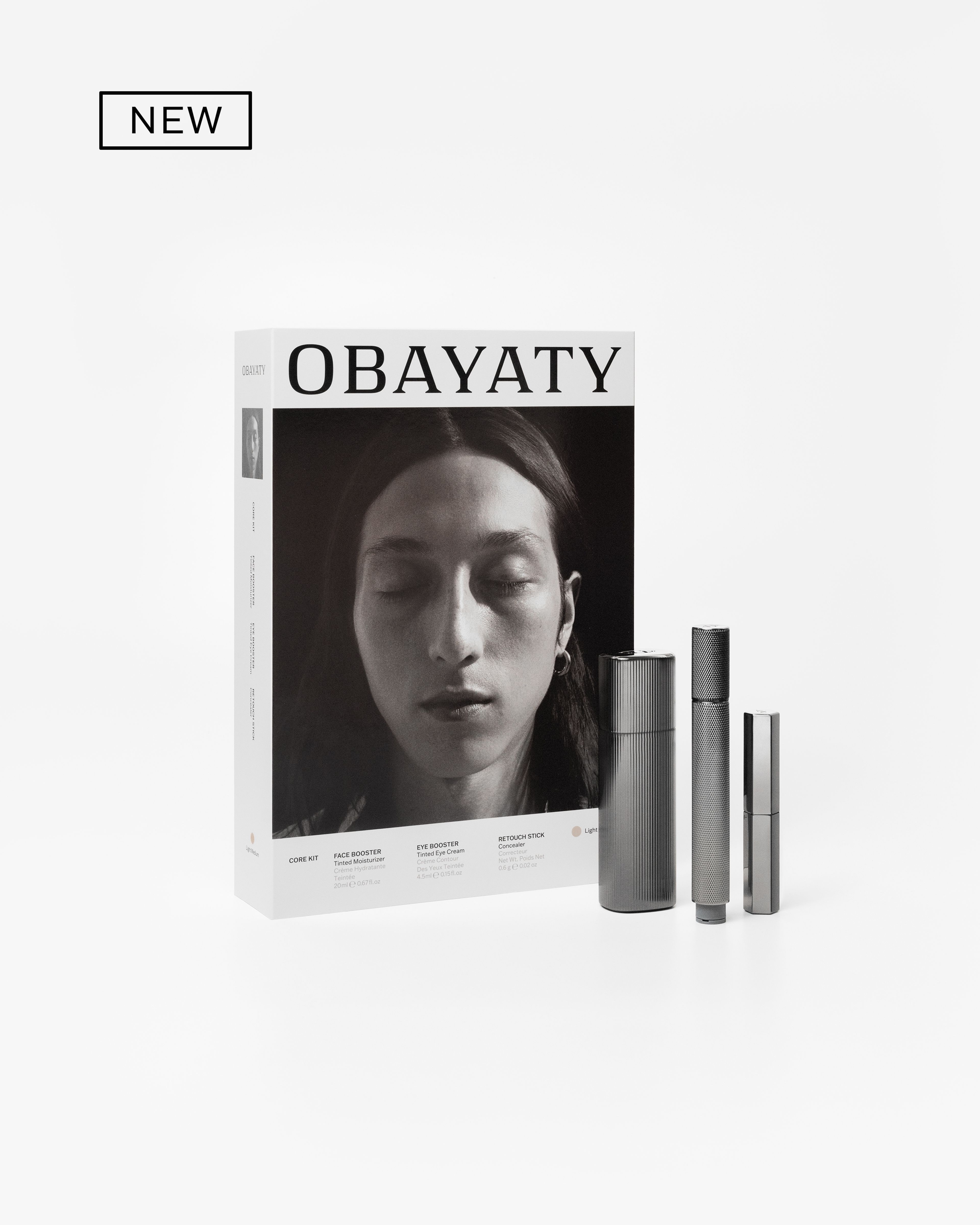 Men's make up kit laying on a grey background