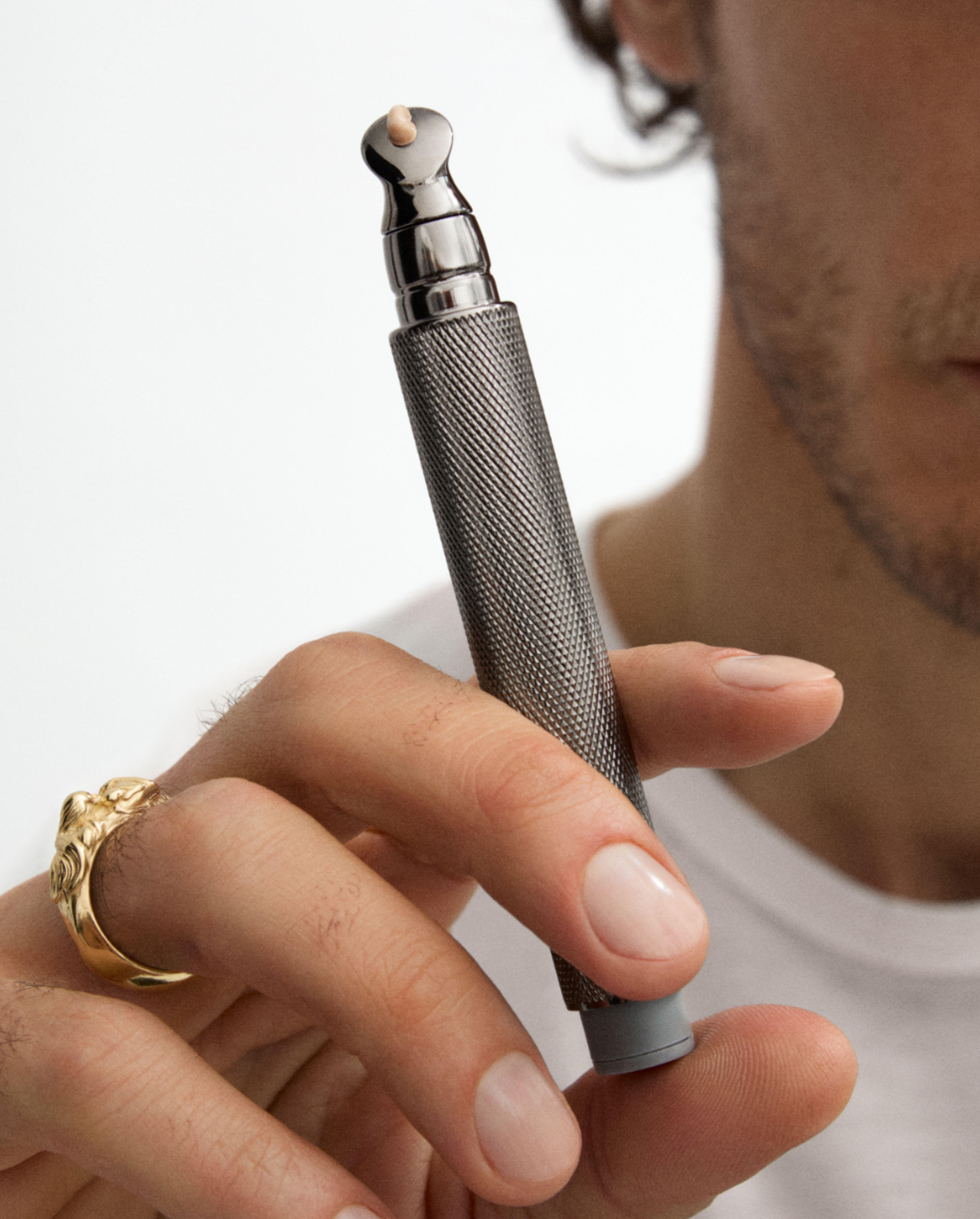 Man brushing his eye brow