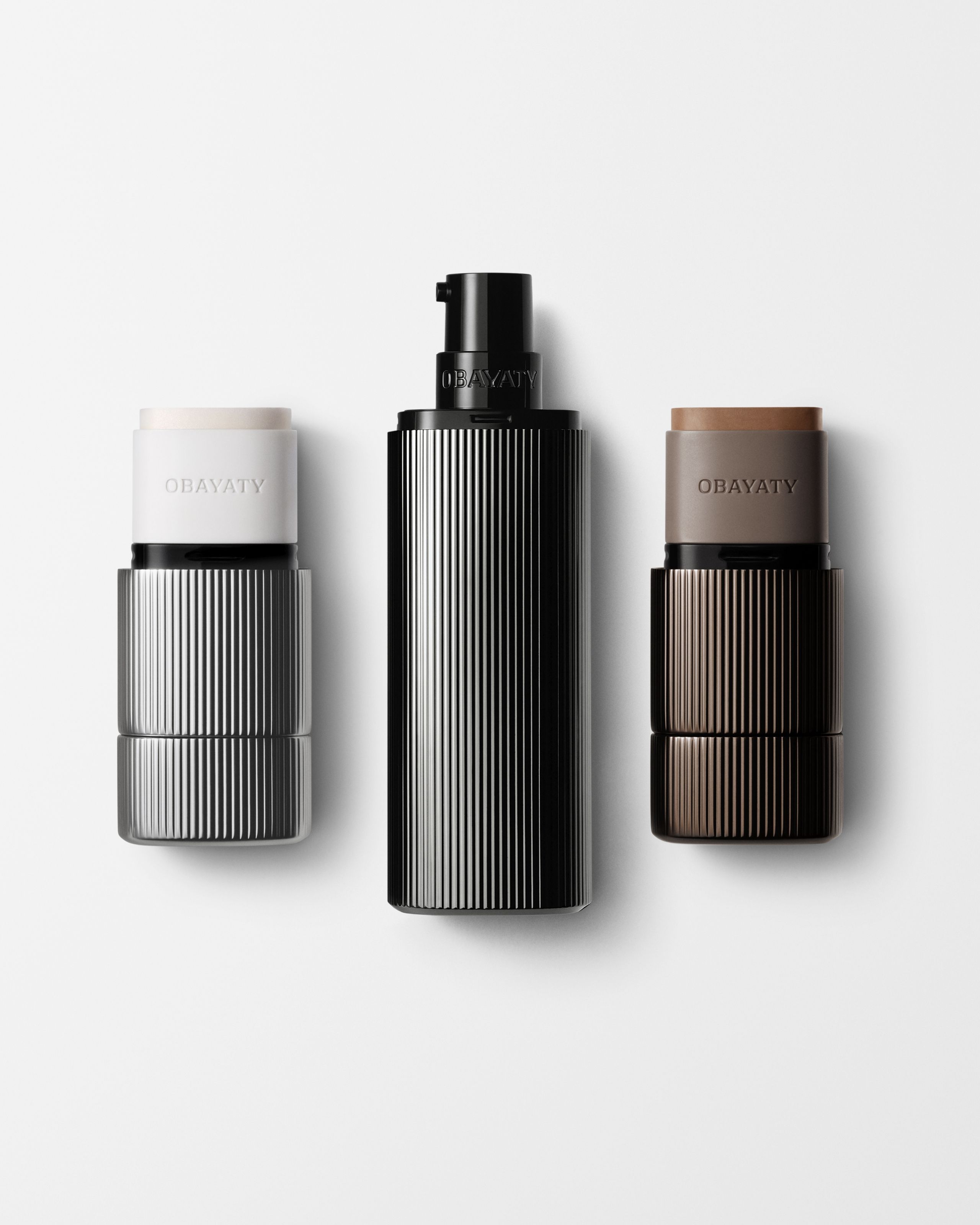 Make up kit for men laying on a grey background