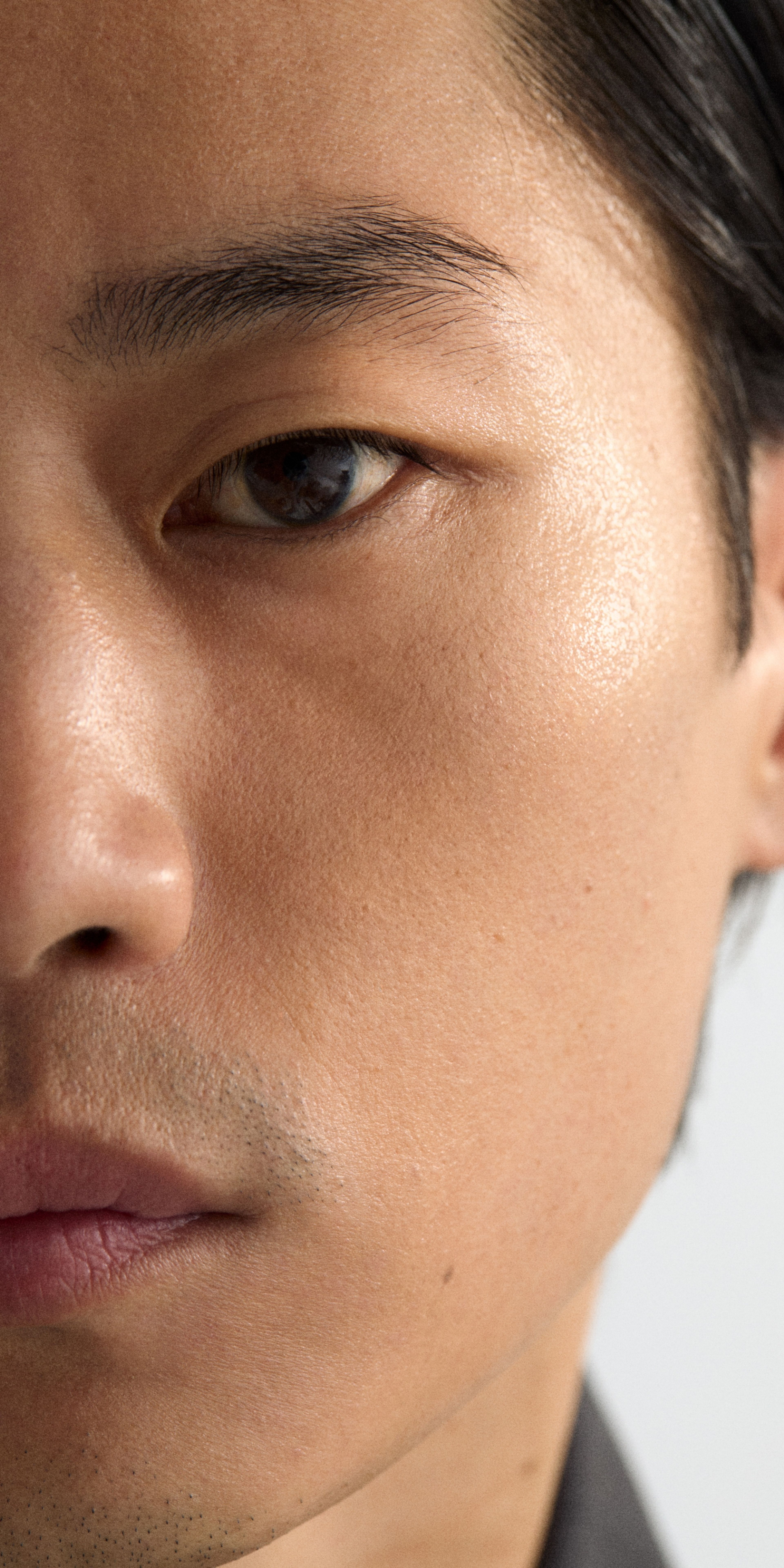 Man looking into the camera with face booster applied
