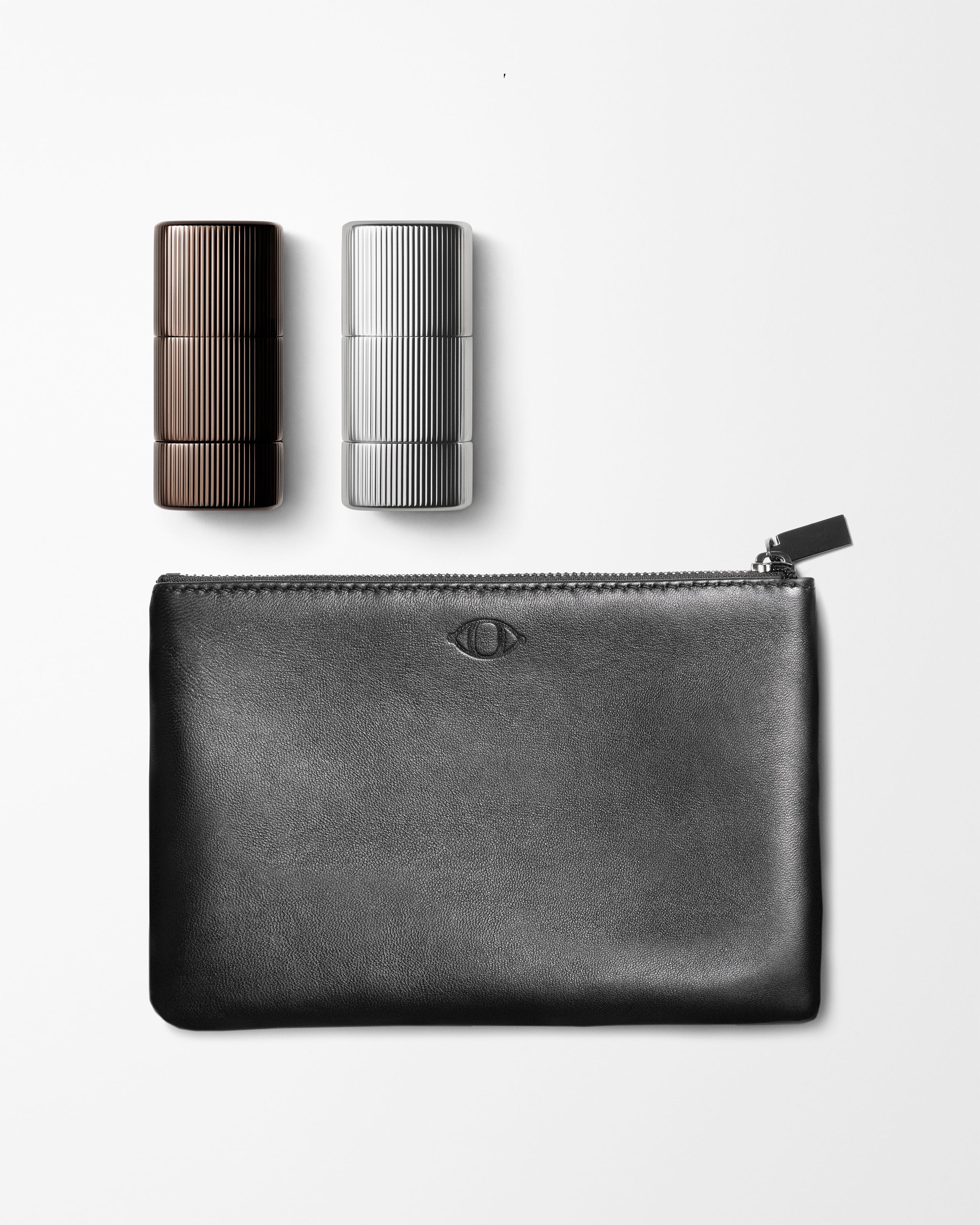 Make up kit for men laying on a grey background