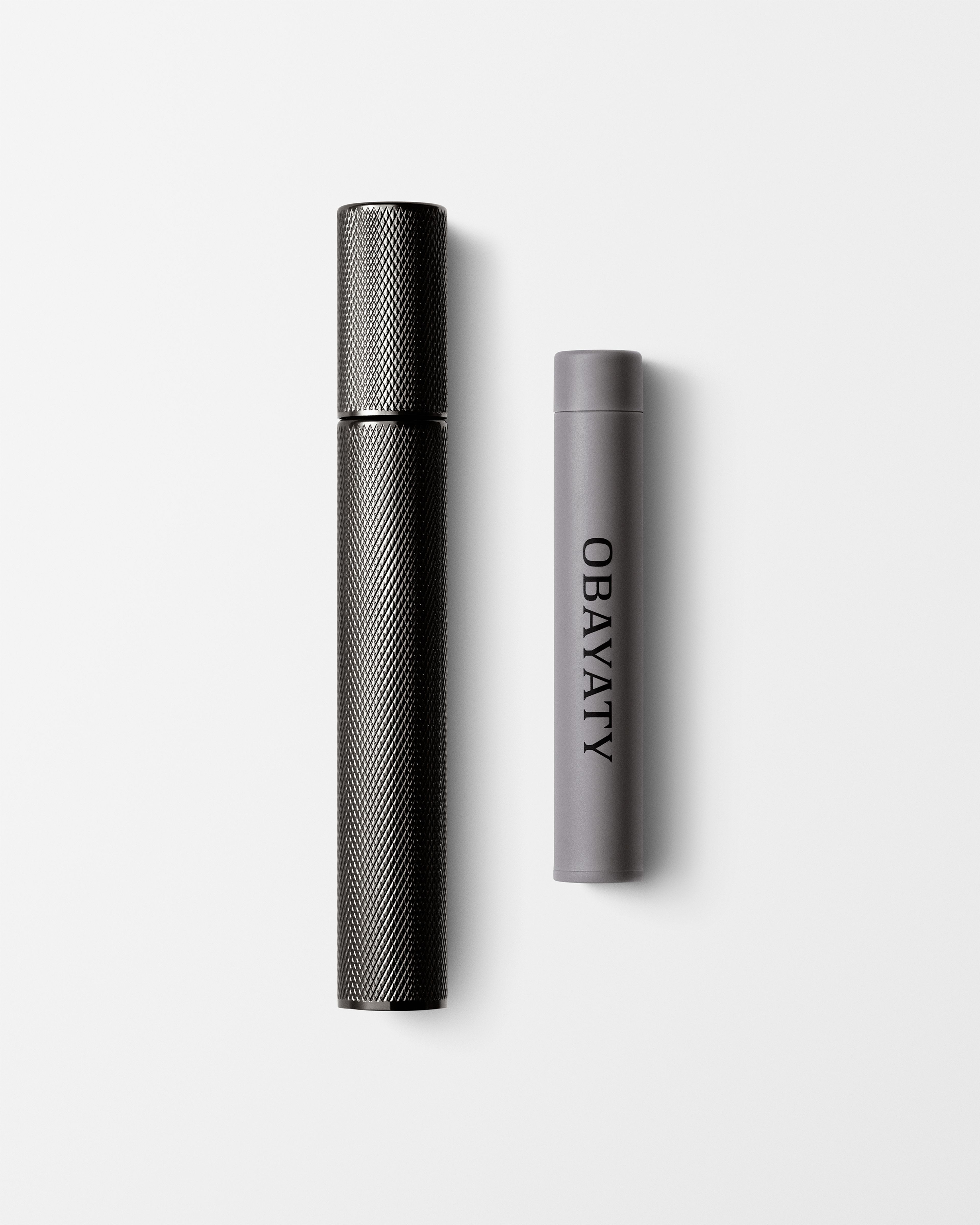 Tinted Moisturizer for men laying on a grey surface