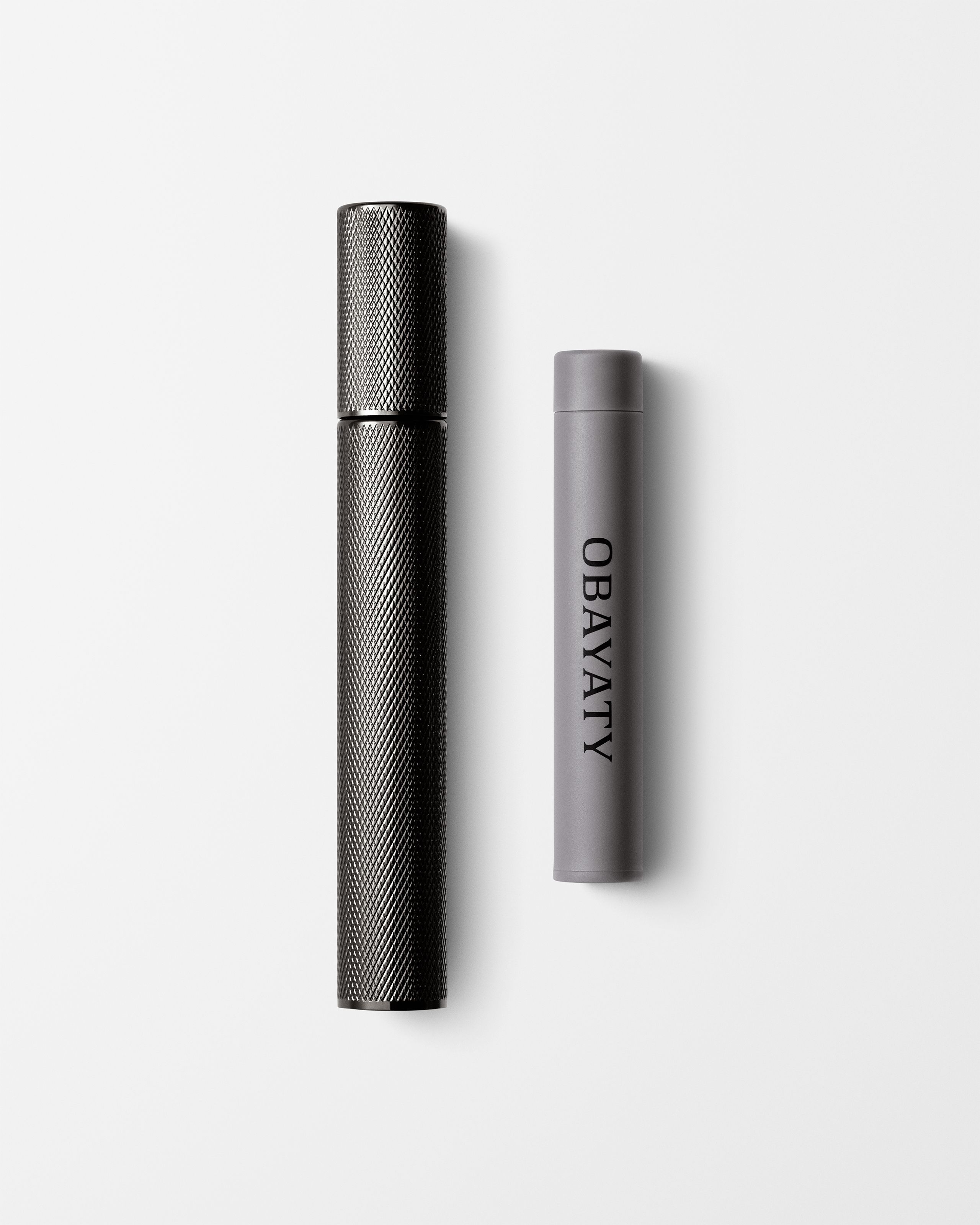 Tinted Moisturizer for men laying on a grey surface