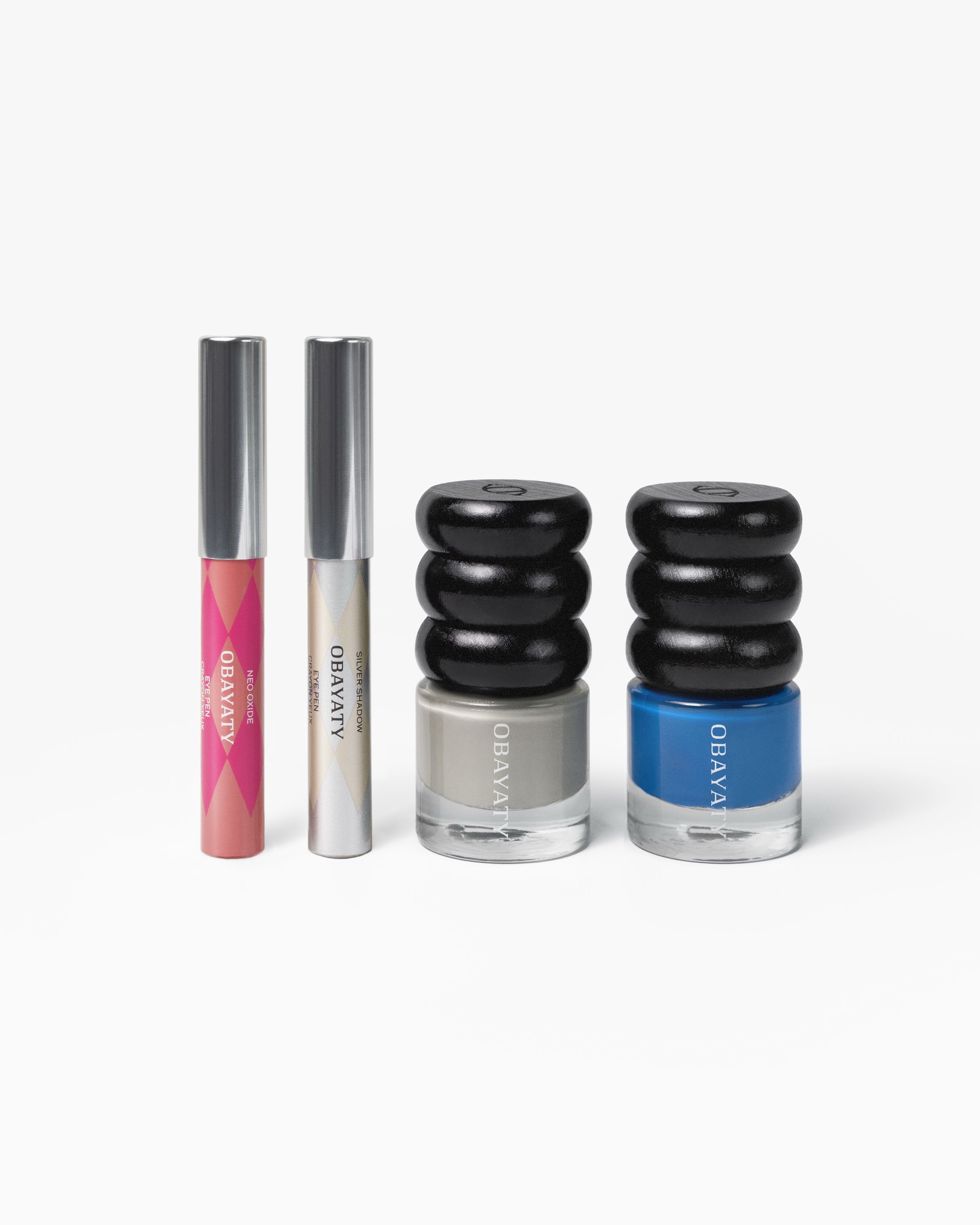 Make up kit for men laying on a grey background