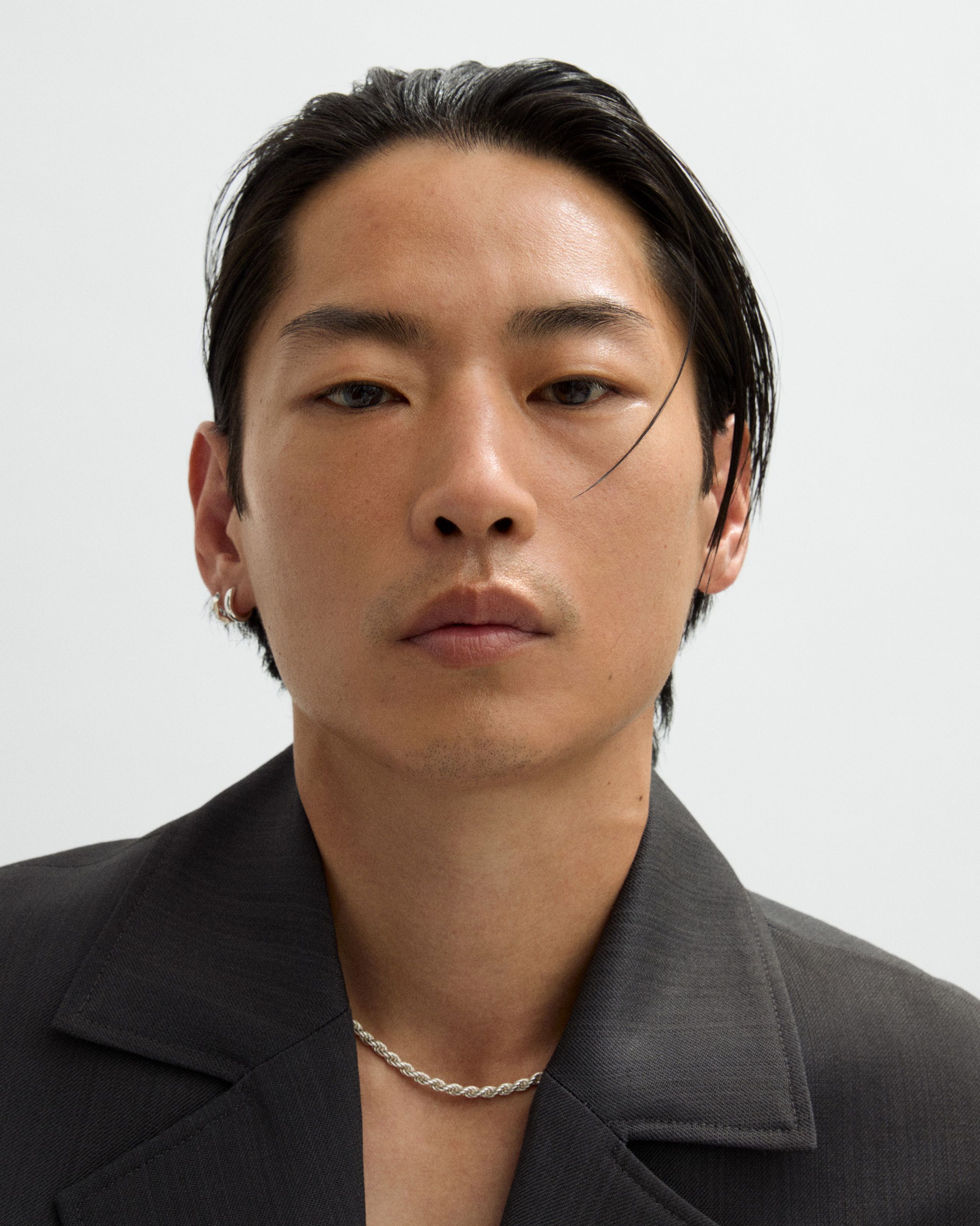 Bronzer for men laying on a grey surface