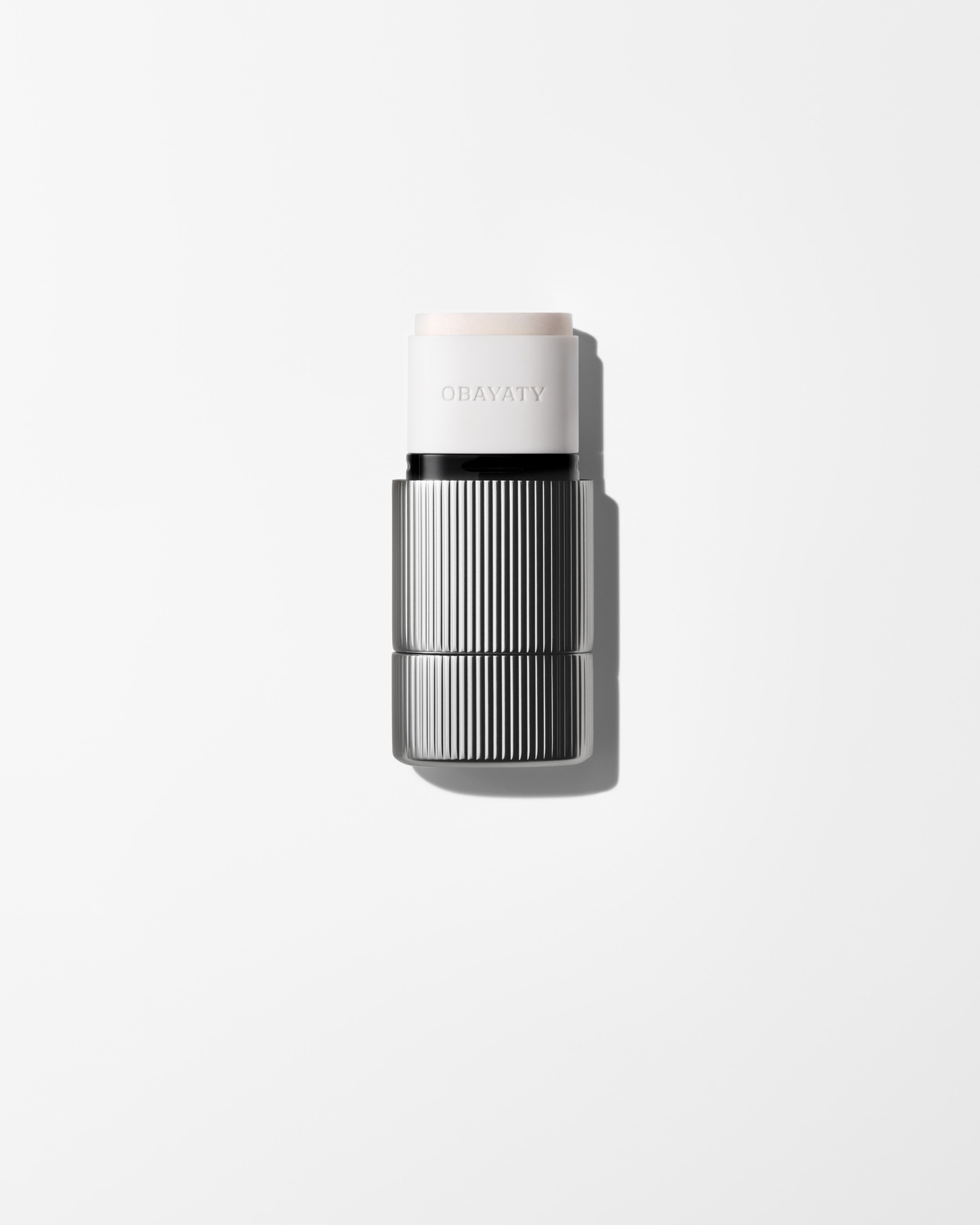 Bronzer for men laying on a grey surface