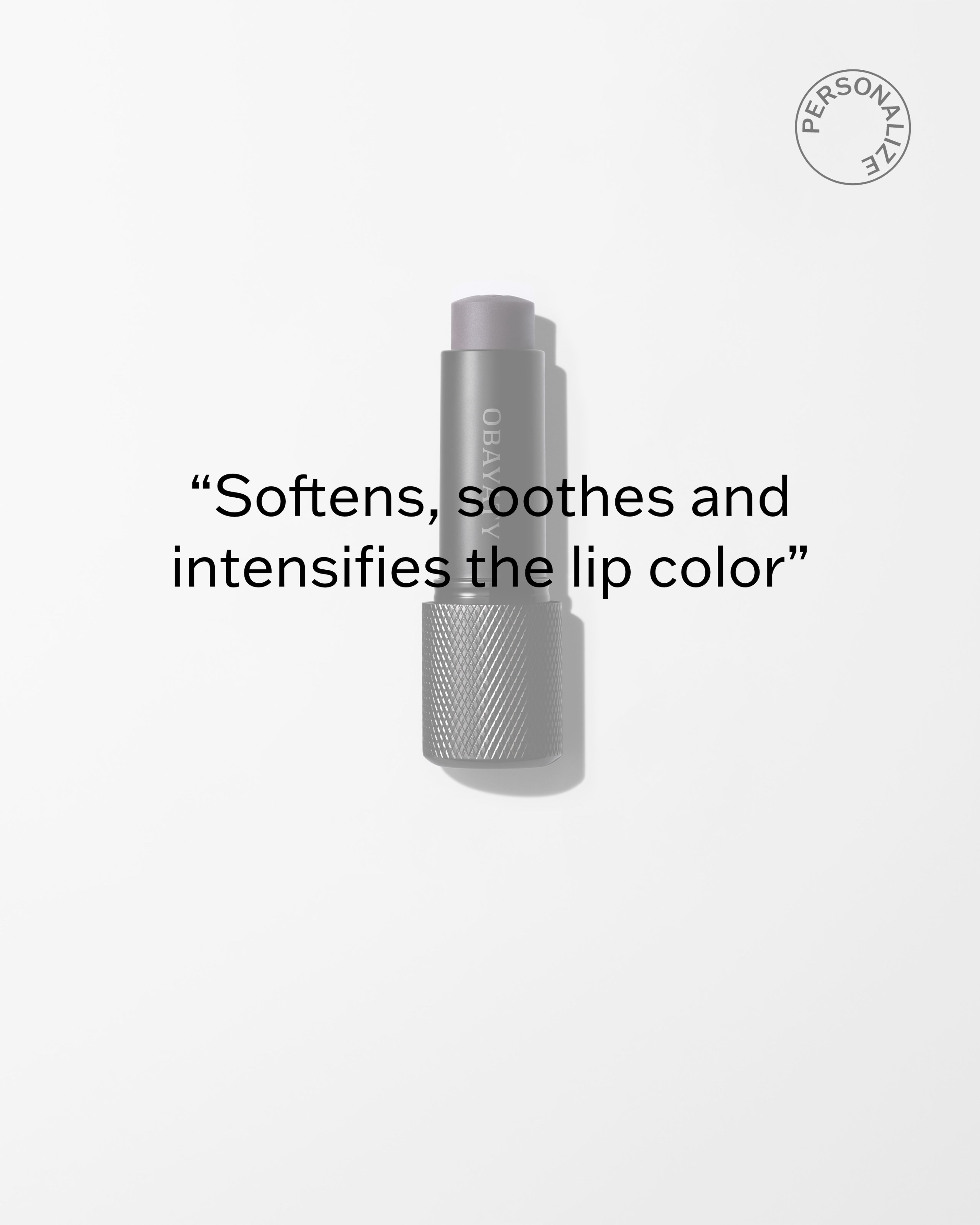 Enhancing Lip Balm laying on a grey surface