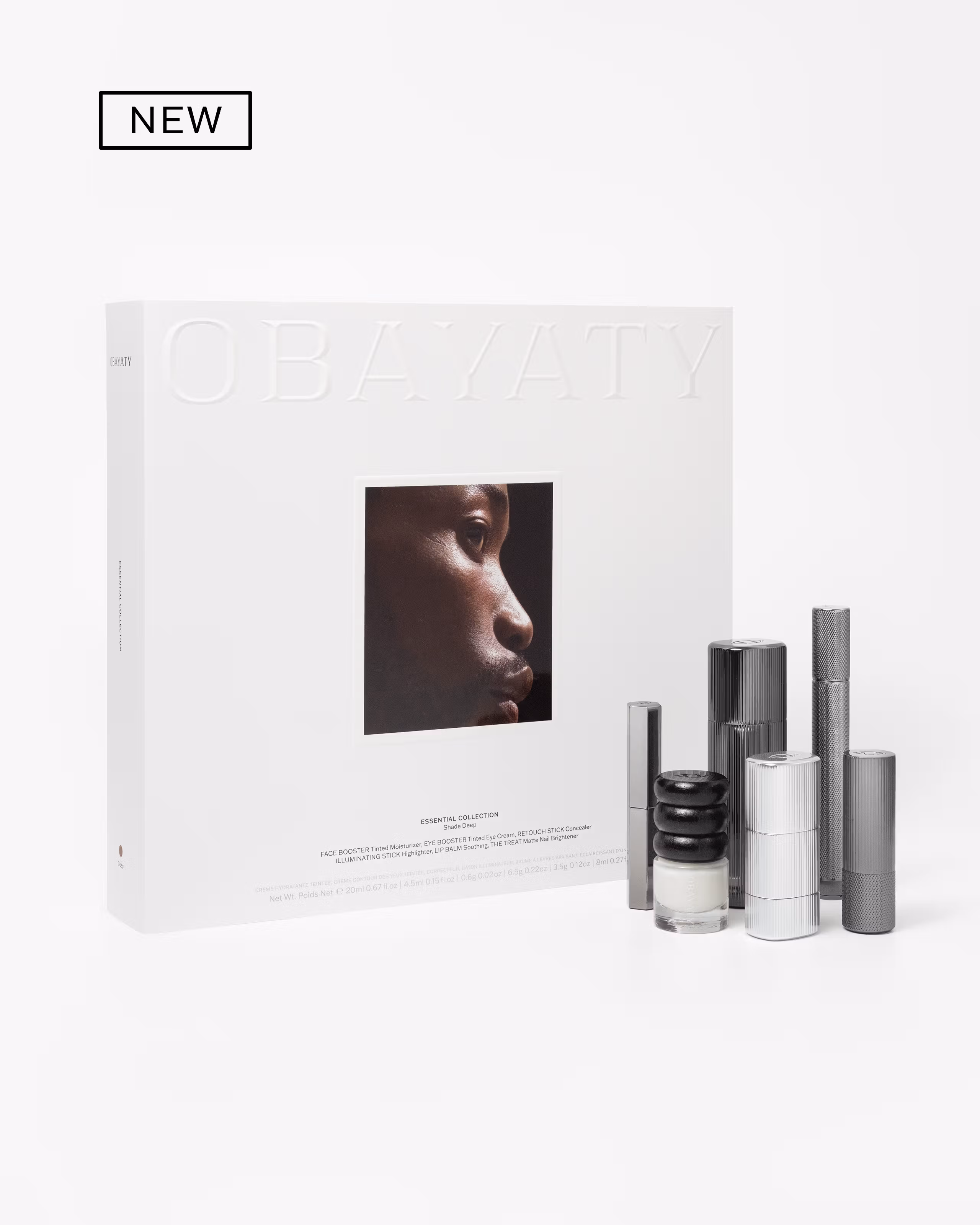 Men's make up kit laying on a grey background