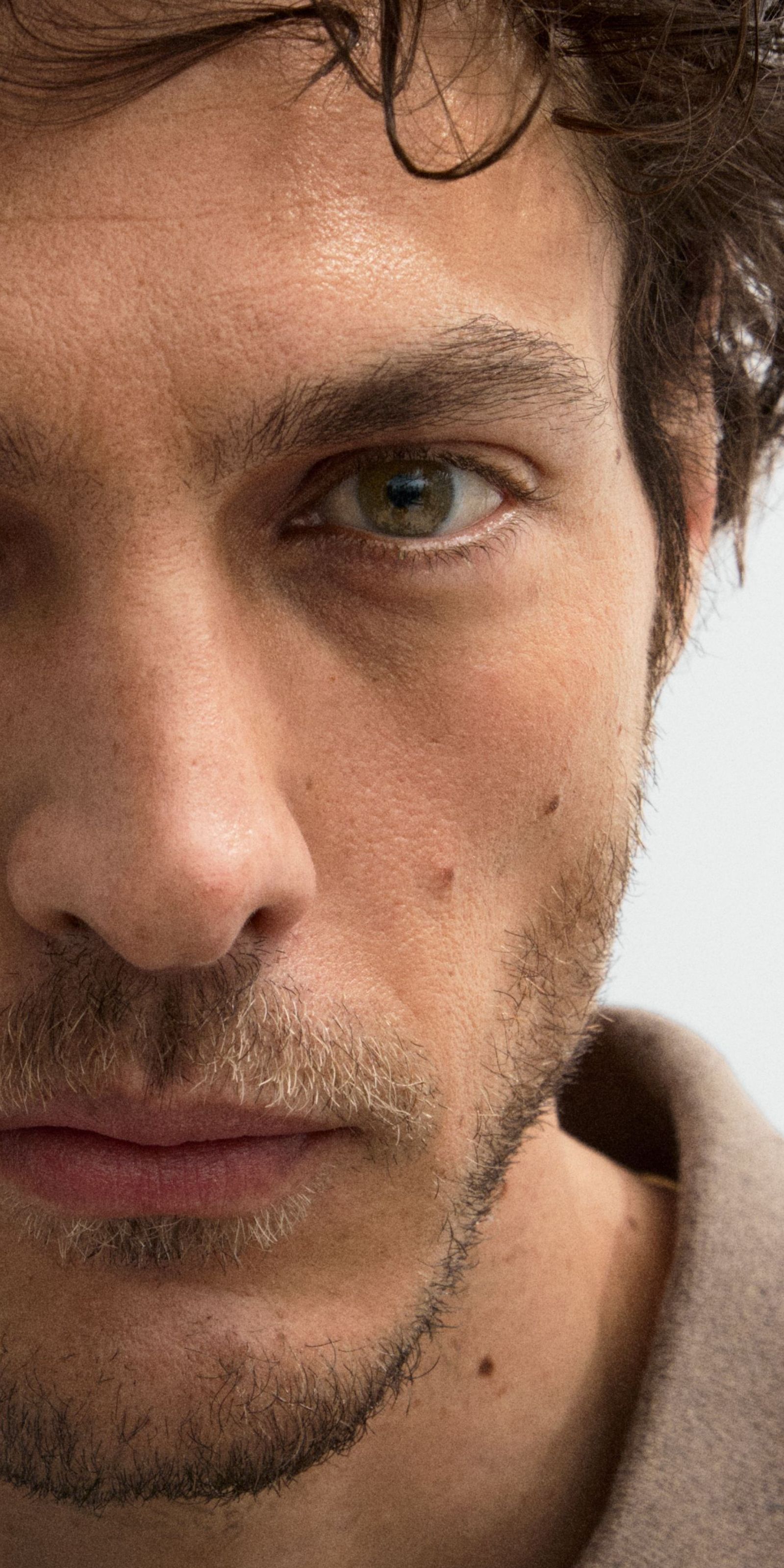 Man looking into the camera with face booster applied